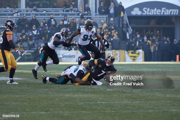 Playoffs: Pittsburgh Steelers QB Ben Roethlisberger in action vs Jacksonville Jaguars Marcell Dareus at Heinz Field. Sequence. Pittsburgh, PA...