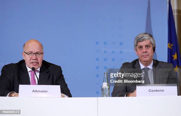 Peter Altmaier, Germanys acting finance minister, left, speaks as he sits beside Mario Centeno, Portugal's finance minister and head of the group of...