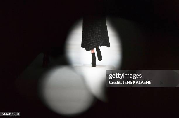 Model presents a creation by the label "Maisonnoee" during the Fashion Week in Berlin on January 17, 2018. / AFP PHOTO / dpa / Jens Kalaene / Germany...