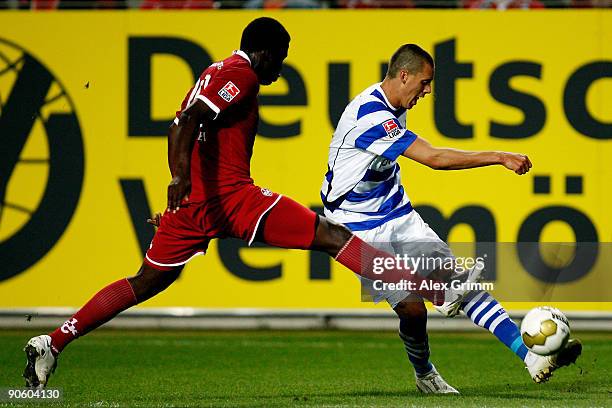 Sandro Wagner of Duisburg is challenged by Rodnei of Kaiserslautern during the Second Bundesliga match between 1. FC Kaiserslautern and MSV Duisburg...