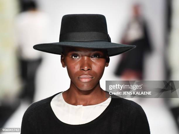 Model presents a creation by the label "Maisonnoee" during the Fashion Week in Berlin on January 17, 2018. / AFP PHOTO / dpa / Jens Kalaene / Germany...