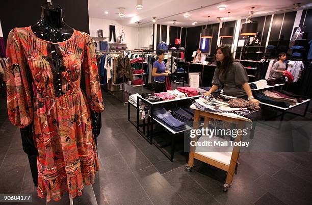 Dresses are displayed at Mango, a clothing store, at Select Citywalk in New Delhi on Wednesday, September 9, 2009.