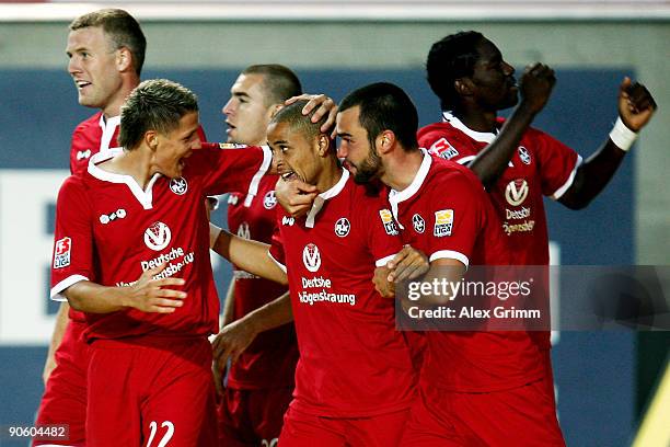 Sidney Sam of Kaiserslautern celebrates scoring his team's second goal with team mates Ivo Ilicevic and Bastian Schulz during the Second Bundesliga...