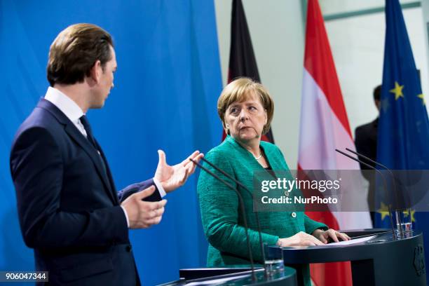 German Chancellor Angela Merkel and Austrian Chancellor Sebastian Kurz are pictured during a press conference at the Chancellery in Berlin, Germany...