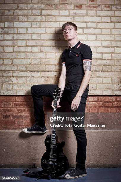 Portrait of American musician Jade Puget, guitarist with hard rock group AFI, photographed backstage before a live performance at Alexandra Palace in...