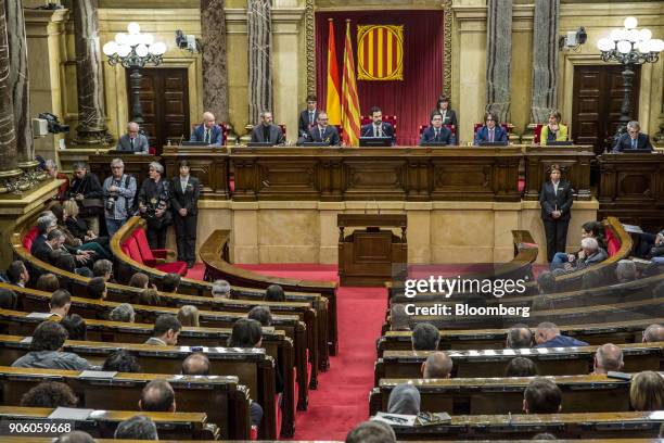 Roger Torrent, new president of the Catalan parliament, center, sits with fellow parliamentary board members, from left, Joan Garcia, Eusebi...