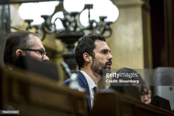 Roger Torrent, lawmaker with Esquerra Republicana de Catalunya , center, speaks to lawmakers after being invested as the new president of the Catalan...