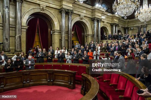 Lawmakers prepare to leave following the conclusion of the first session of the Catalan parliament in Barcelona, Spain, on Wednesday, Jan. 17, 2018....