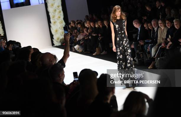 Model presents a creation by the label "Maisonnoee" during the Fashion Week in Berlin on January 17, 2018. / AFP PHOTO / ZB AND dpa / Britta Pedersen...