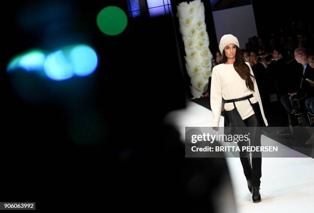 Model presents a creation by the label "Maisonnoee" during the Fashion Week in Berlin on January 17, 2018. / AFP PHOTO / ZB AND dpa / Britta Pedersen...