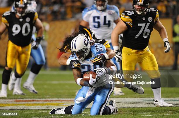 Safety Troy Polamalu of the Pittsburgh Steelers tackles running back LenDale White of the Tennessee Titans at Heinz Field on September 10, 2009 in...