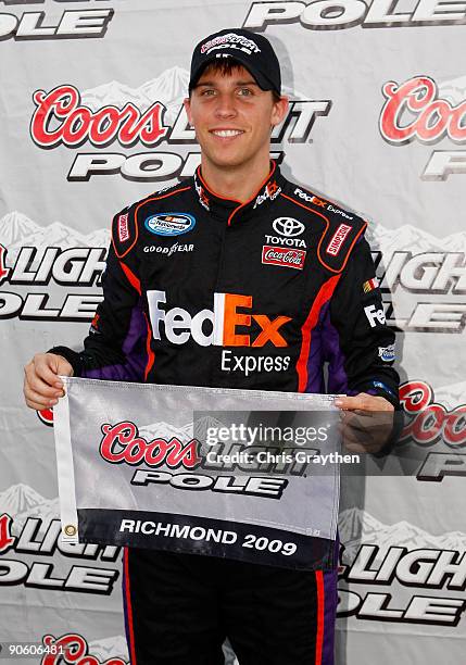 Denny Hamlin, driver of the Z-Line Designs Toyota, celebrates after setting the pole position for the NASCAR Nationwide Series Virginia 529 College...