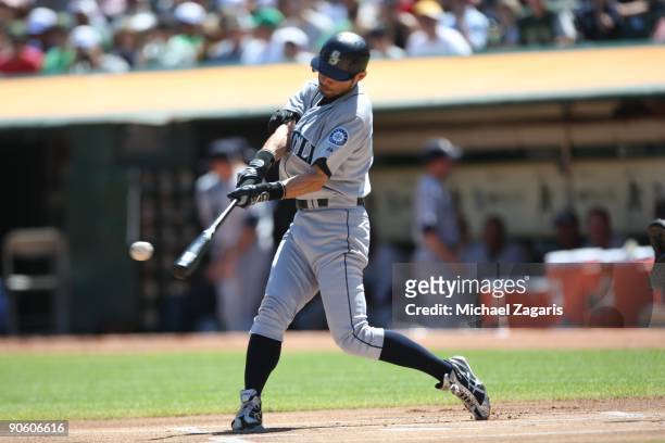 Ichiro Suzuki of the Seattle Mariners hits his 2000th career hit during the game against the Oakland Athletics at the Oakland Coliseum in Oakland,...