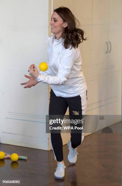 Catherine, Duchess of Cambridge, Patron of the All England Lawn Tennis and Croquet Club plays a game during a visit to Bond Primary School in Mitcham...