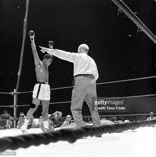 World Heavyweight Title. Muhammad Ali victorious with referee Harry Kessler after winning fight vs Cleveland Williams at Astrodome. Houston, TX...
