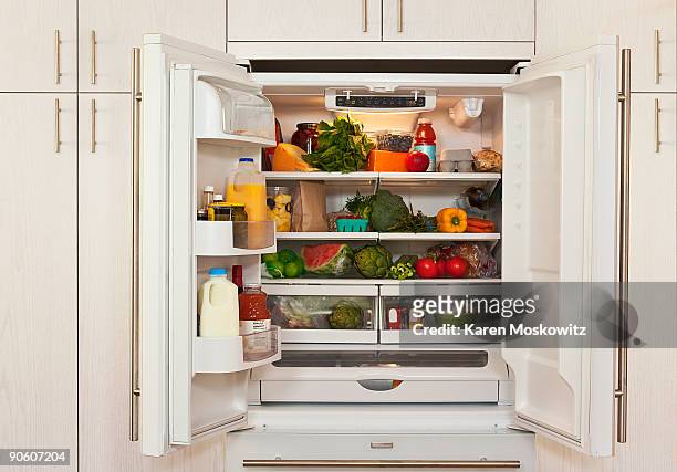 view of inside of refrigerator with healthy food - refrigerator stock pictures, royalty-free photos & images
