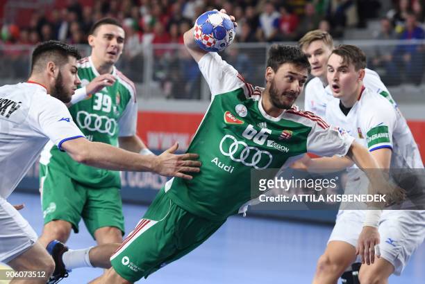 Hungary's Mate Lekai shoots to score a goal during the group D match of the Men's 2018 EHF European Handball Championships between Czech Republic and...