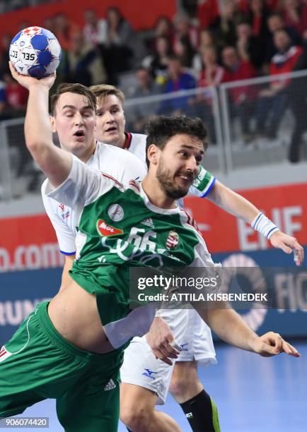 Hungary's Mate Lekai shoots to score a goal during the group D match of the Men's 2018 EHF European Handball Championships between Czech Republic and...