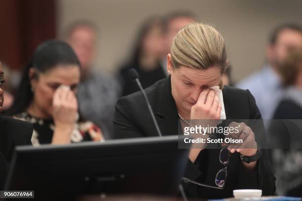 Maggie Nichols , mother of victim Gina Nichols and Assistant Attorney General Angela Povilaitis wipes tears from their eyes as they listen to Gwen...