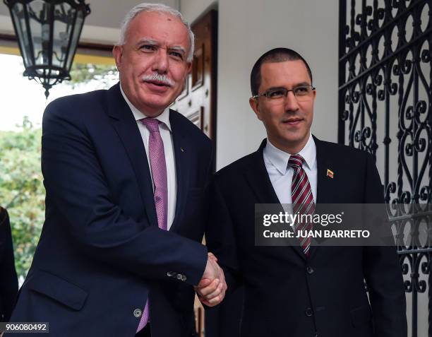 Venezuelan Foreign Minister Jorge Arreaza shakes hands with the Foreign Minister of the Palestinian Authority Riyad al-Malk before a meeting in...