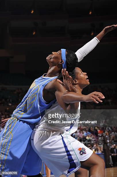 Sylvia Fowles of the Chicago Sky and Kia Vaughn of the New York Liberty battle for rebound position during the game on August 14, 2009 at Madison...