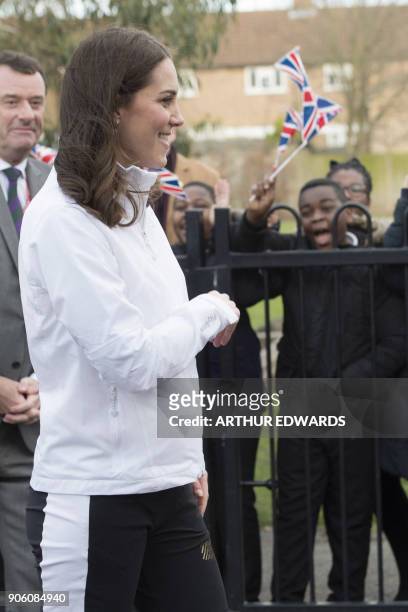 Britain's Catherine, Duchess of Cambridge and Patron of the All England Lawn Tennis and Croquet Club visits the Bond Primary School to see the work...
