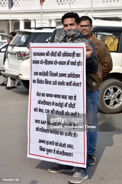 And former Minister Kapil Mishra holding a banner against Delhi Chief Minister Arvind Kejriwal during Delhi Assembly Winter Session at Delhi Vidhan...