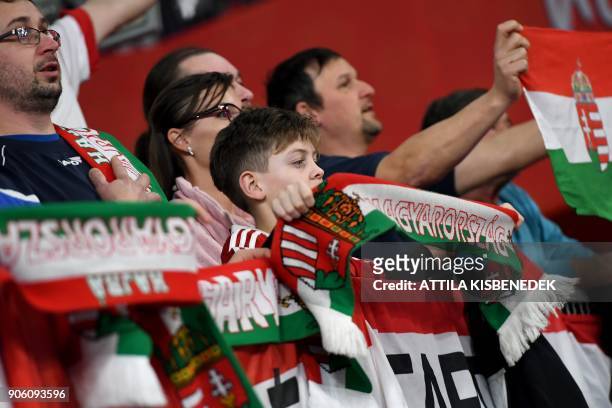Hungary's fans sing their national anthem during their group 'D' match of the 13th Men's European Handball Championships against the Czech Republic...