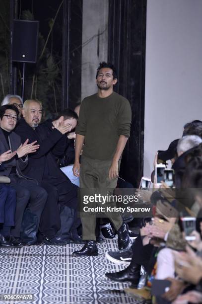 Designer Haider Ackermann acknowledges the audience during the Haider Ackermann Menswear Fall/Winter 2018-2019 show as part of Paris Fashion Week on...