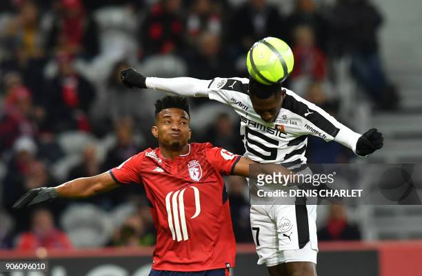 Lille's Brazilian midfielder Thiago Mendes Rennes' Congolese forward Ismaila Sarr go for a header during the French L1 football match between Lille...