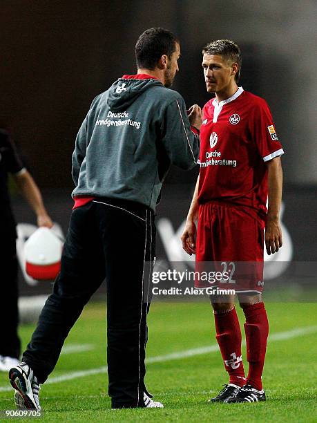 Ivo Ilicevic of Kaiserslautern receives instructions from Head coach Marco Kurz during the Second Bundesliga match between 1. FC Kaiserslautern and...