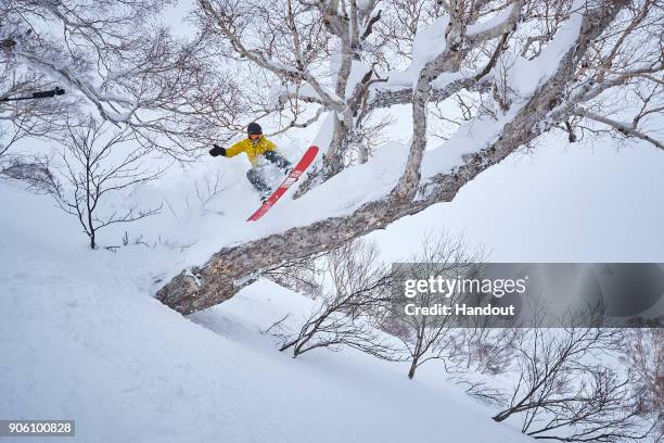 In this handout image provided by Monster Energy, Four-time F1 World Champion Lewis Hamilton hones his snowboarding skills with some of the world's...