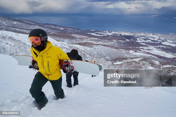 In this handout image provided by Monster Energy, Four-time F1 World Champion Lewis Hamilton leads a group up the mountain as he hones his...