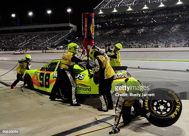Paul Menard, driver of the Menards Ford, makes a pit stop during the NASCAR Nationwide Series Virginia 529 College Savings Plan 250 at Richmond...