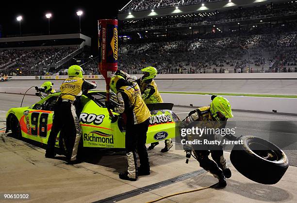 Paul Menard, driver of the Menards Ford, makes a pit stop during the NASCAR Nationwide Series Virginia 529 College Savings Plan 250 at Richmond...