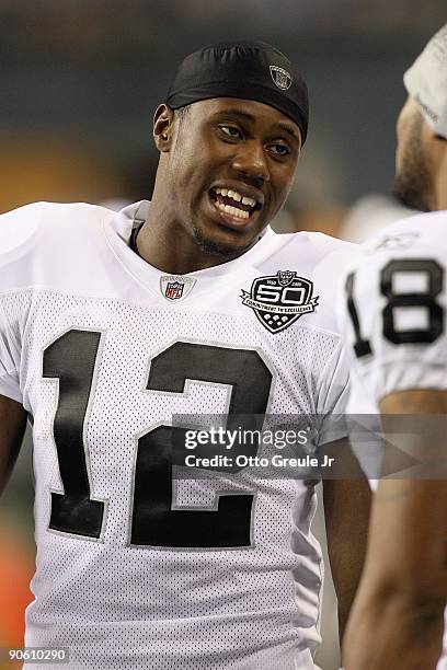 Darrius Heyward-Bey of the Oakland Raiders talks on the sidelines during the game against the Seattle Seahawks on September 3, 2009 at Qwest Field in...