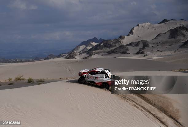 Toyota's driver Giniel De Villiers of South Africa and his co-driver Dirk Von Zitzewitz of Germany compete during the Stage 11 of the 2018 Dakar...