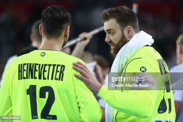Goalkeepers Silvio Heinevetter of Germany and Andreas Wolff of Germany talk during the Men's Handball European Championship Group C match between...