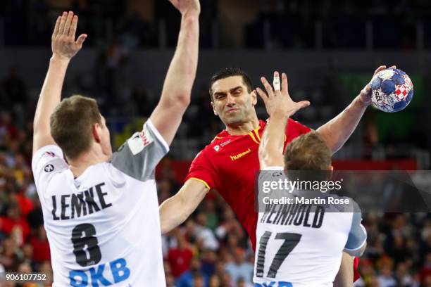 Kiril Lazarov of Macedonia is blocked by Finn Lemke of Germany and Steffen Weinhold of Germany during the Men's Handball European Championship Group...