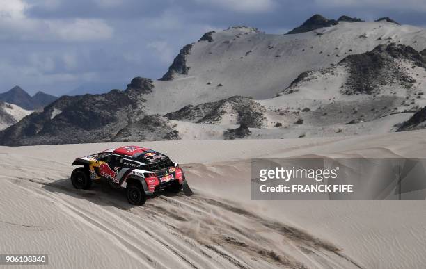 Peugeot's French driver Cyril Despres and co-driver David Castera of France compete during the Stage 11 of the 2018 Dakar Rally between Belen and...
