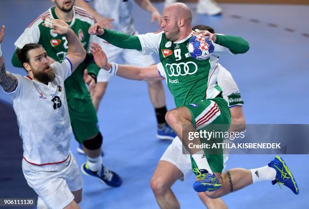 Czech Republic's Pavel Horak vies with Hungary's Zsolt Balogh in Varazdin Arena on January 17, 2018 during their group 'D' match of the 13th Men's...