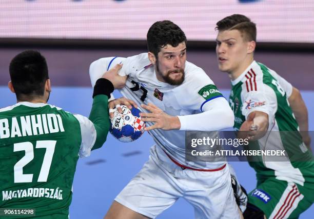 Czech Republic's Ondrej Zdrahala scores a goal as he vies between Hungary's Bence Banhidi and Donat Bartok at the Varazdin Arena during their group...