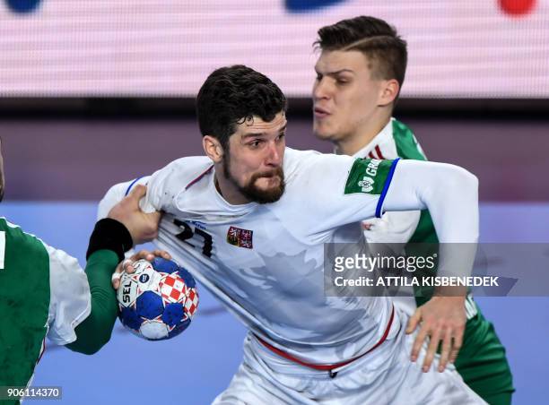 Czech Republic's Ondrej Zdrahala scores a goal as he vies between Hungary's Bence Banhidi and Donat Bartok at the Varazdin Arena during their group...