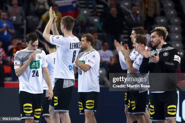 Patrick Groetzki of Germany and Finn Lemke of Germany and players react after the Men's Handball European Championship Group C match between Germany...