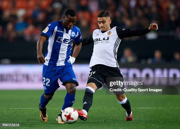Andreas Pereira of Valencia competes for the ball with Mubarak Wakaso of Alaves during the Copa Del Rey 1st leg match between Valencia and Alaves at...