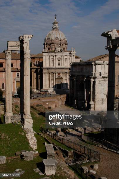 Italy, Rome. Roman Forum. Arch of Septimus Severus and Church Santi Luca and Martina.