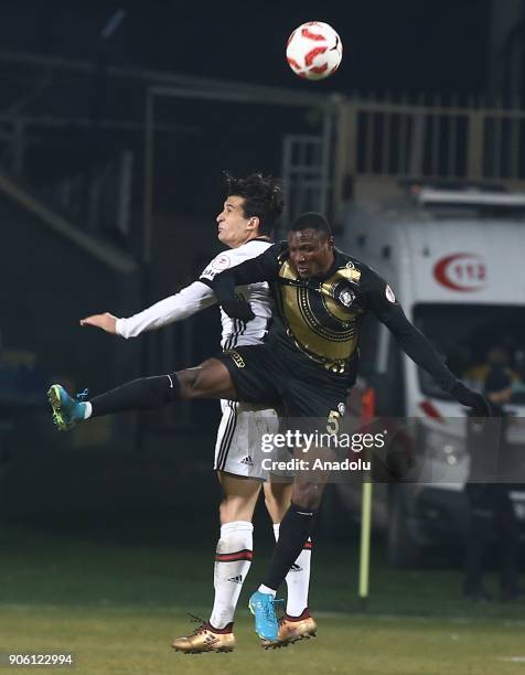 Necip Uysal of Besiktas in action against Aminu Umar of Osmanlispor during the Turkish Ziraat Cup soccer match between Osmanlispor and Besiktas at...