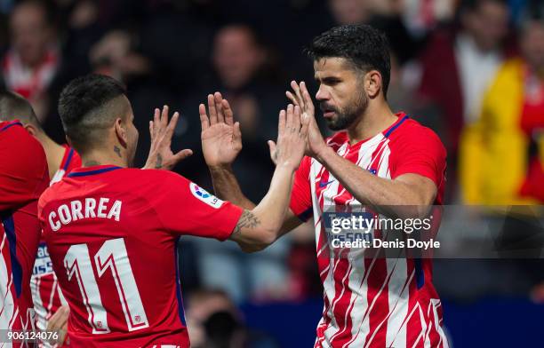 Diego Costa of Atletico Madrid celebrates with Angel Correa after scoring his team's opening goal during the Copa del Rey, Quarter Final, First Leg...