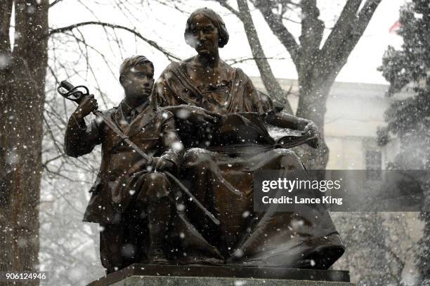 Snow falls on the Confederate Women's Monument at the State Capitol Grounds on January 17, 2018 in Raleigh, North Carolina. Governor Roy Cooper...