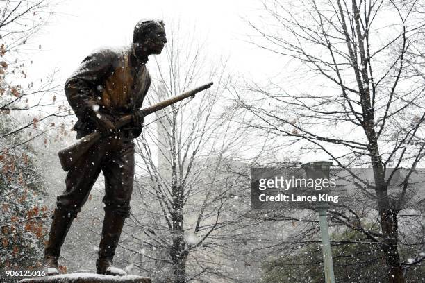 Snow falls on the Henry Lawson Wyatt Monument at the State Capitol Grounds on January 17, 2018 in Raleigh, North Carolina. Governor Roy Cooper...